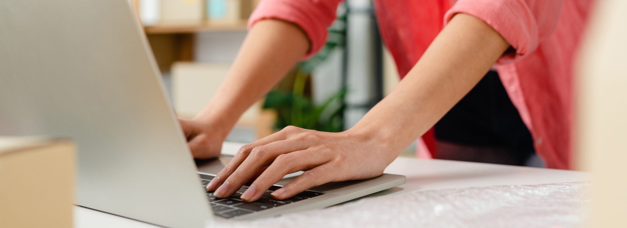 A picture of a person using a laptop.